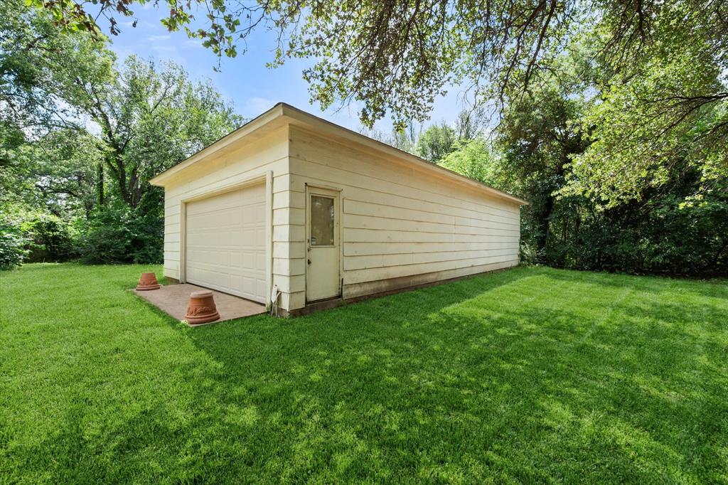 126 Smallwood Court Springtown, TX 76082 - Photo 5 of 24 40x24 Detached garage and interior shop with a single bay door and side entry