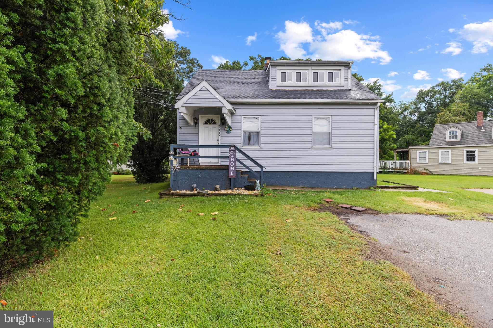 View of front facade with roof with shingles and a