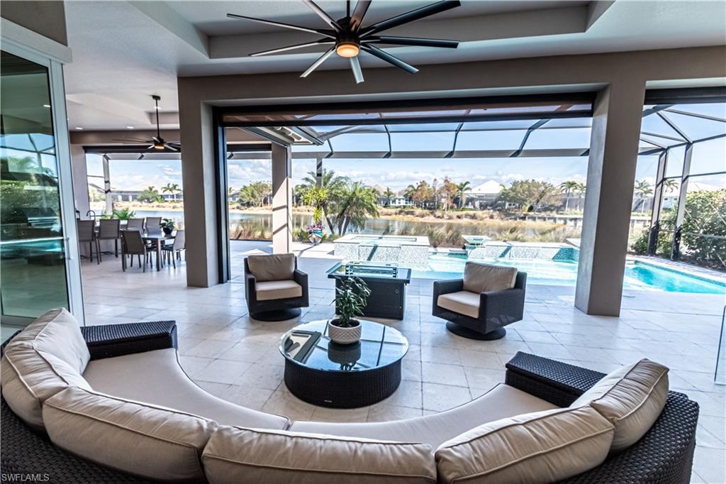 6262 Lightbourn Way Naples, FL 34113 - Photo 1 of 49 a living room with furniture and a large window