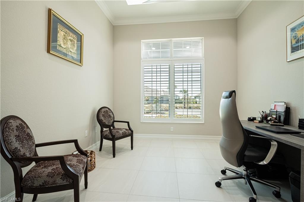 6262 Lightbourn Way Naples, FL 34113 - Photo 21 of 49 a view of a workspace with furniture and a window