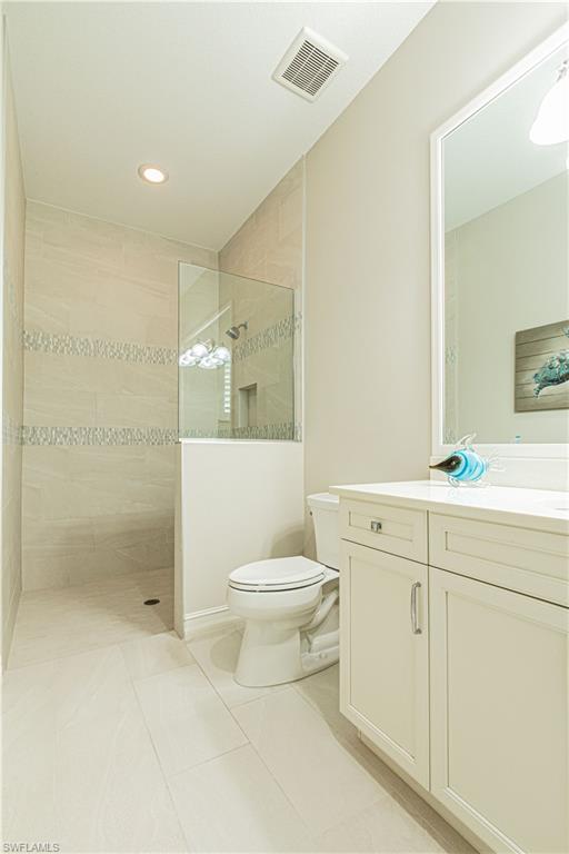 6262 Lightbourn Way Naples, FL 34113 - Photo 34 of 49 a bathroom with a sink toilet and shower