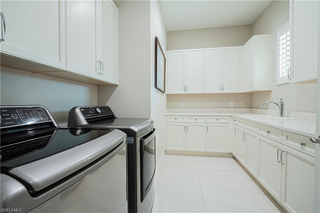 6262 Lightbourn Way Naples, FL 34113 - Photo 37 of 49 a kitchen with a sink and cabinets