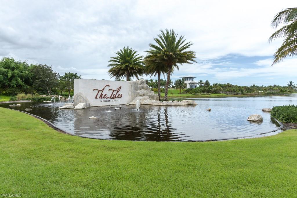 6262 Lightbourn Way Naples, FL 34113 - Photo 41 of 49 a view of a lake with houses in the back