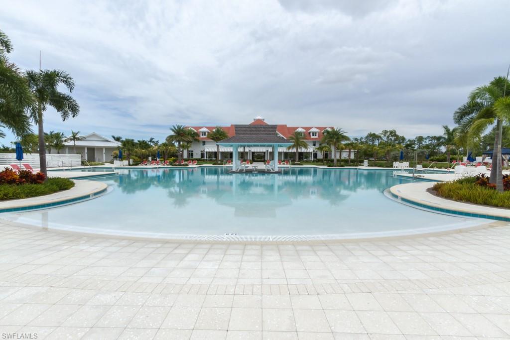 6262 Lightbourn Way Naples, FL 34113 - Photo 44 of 49 a view of a lake with houses in the back
