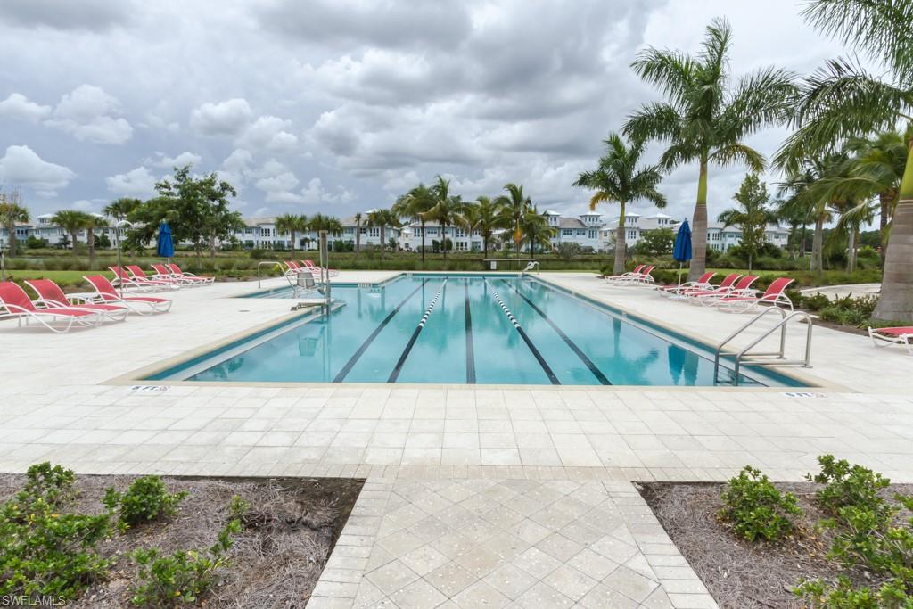 6262 Lightbourn Way Naples, FL 34113 - Photo 45 of 49 a view of swimming pool with outdoor seating and plants