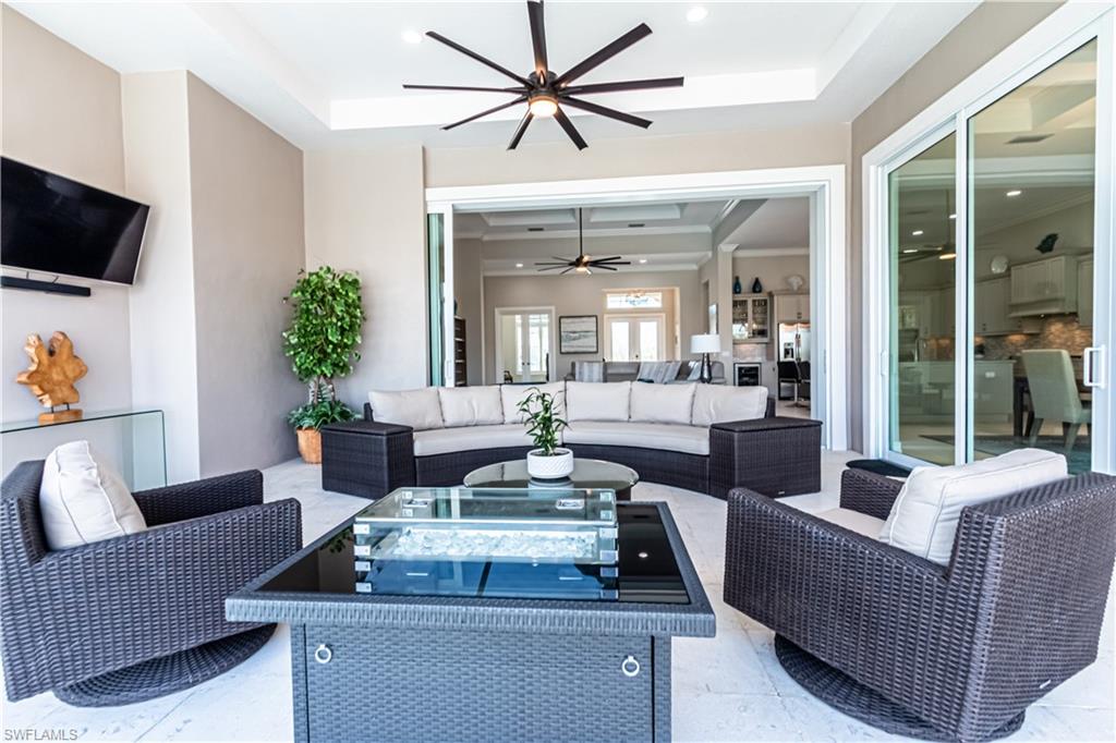 6262 Lightbourn Way Naples, FL 34113 - Photo 7 of 49 a living room with furniture and a large window