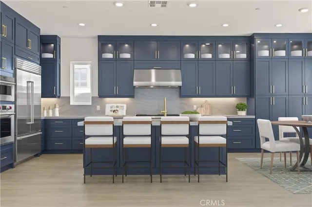 a kitchen with a table and chairs in it