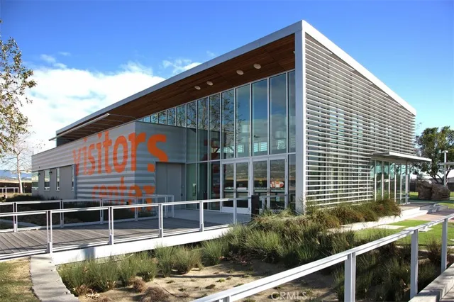 a front view of a house with plants