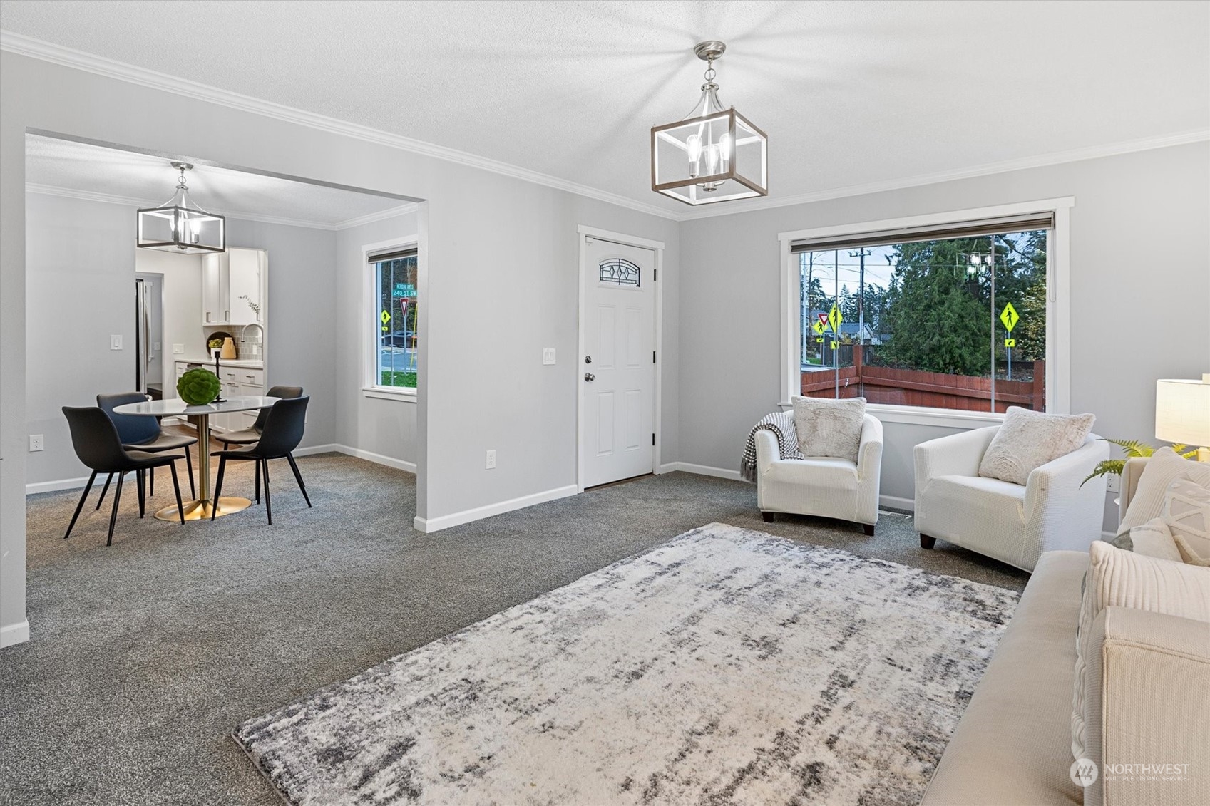 24008 Meridian Avenue South Bothell, WA 98021 - Photo 13 of 31 a living room with furniture and a chandelier