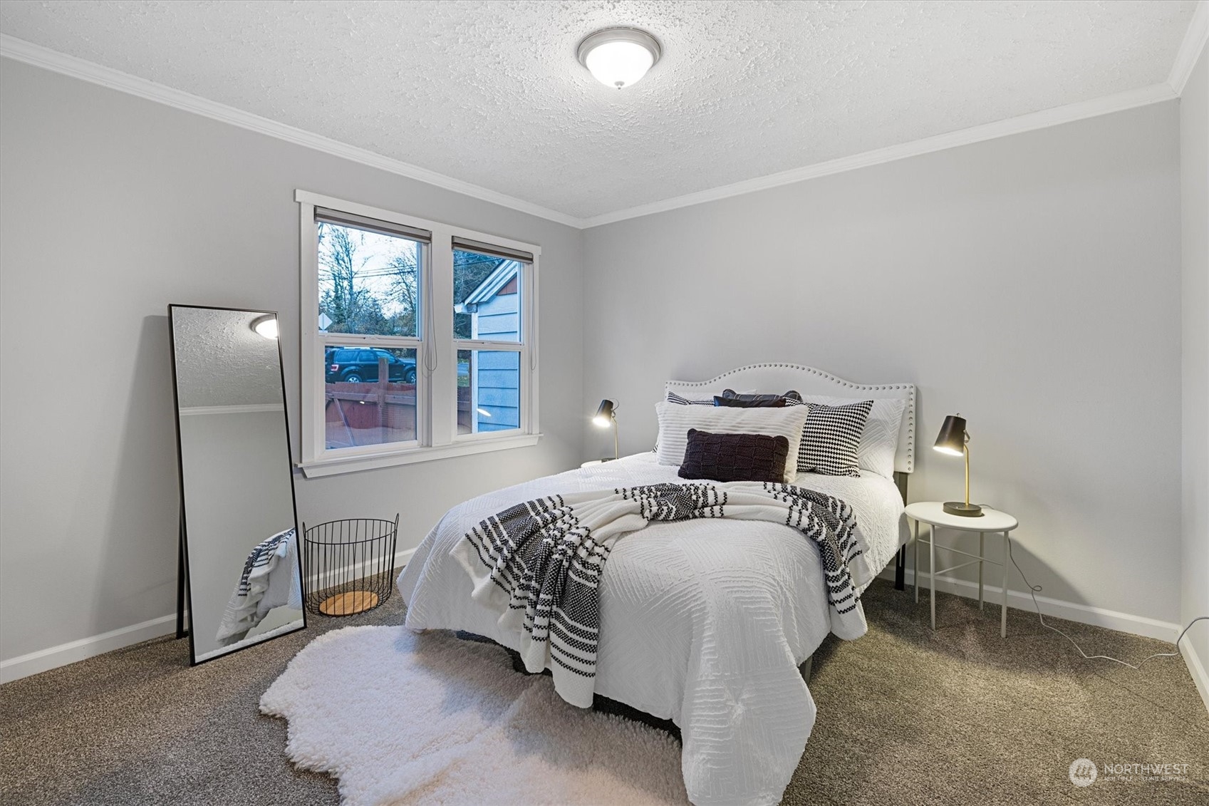 24008 Meridian Avenue South Bothell, WA 98021 - Photo 14 of 31 a bedroom with a bed and wooden floor