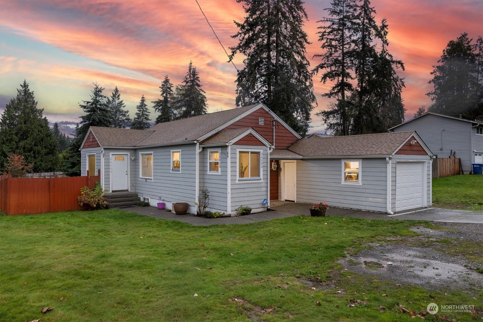 24008 Meridian Avenue South Bothell, WA 98021 - Photo 2 of 31 a front view of a house with a yard and trees