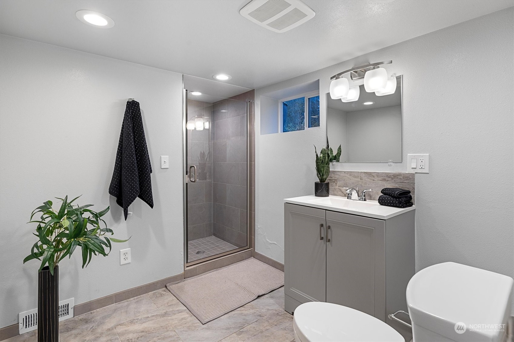 24008 Meridian Avenue South Bothell, WA 98021 - Photo 21 of 31 a bathroom with a toilet sink and mirror