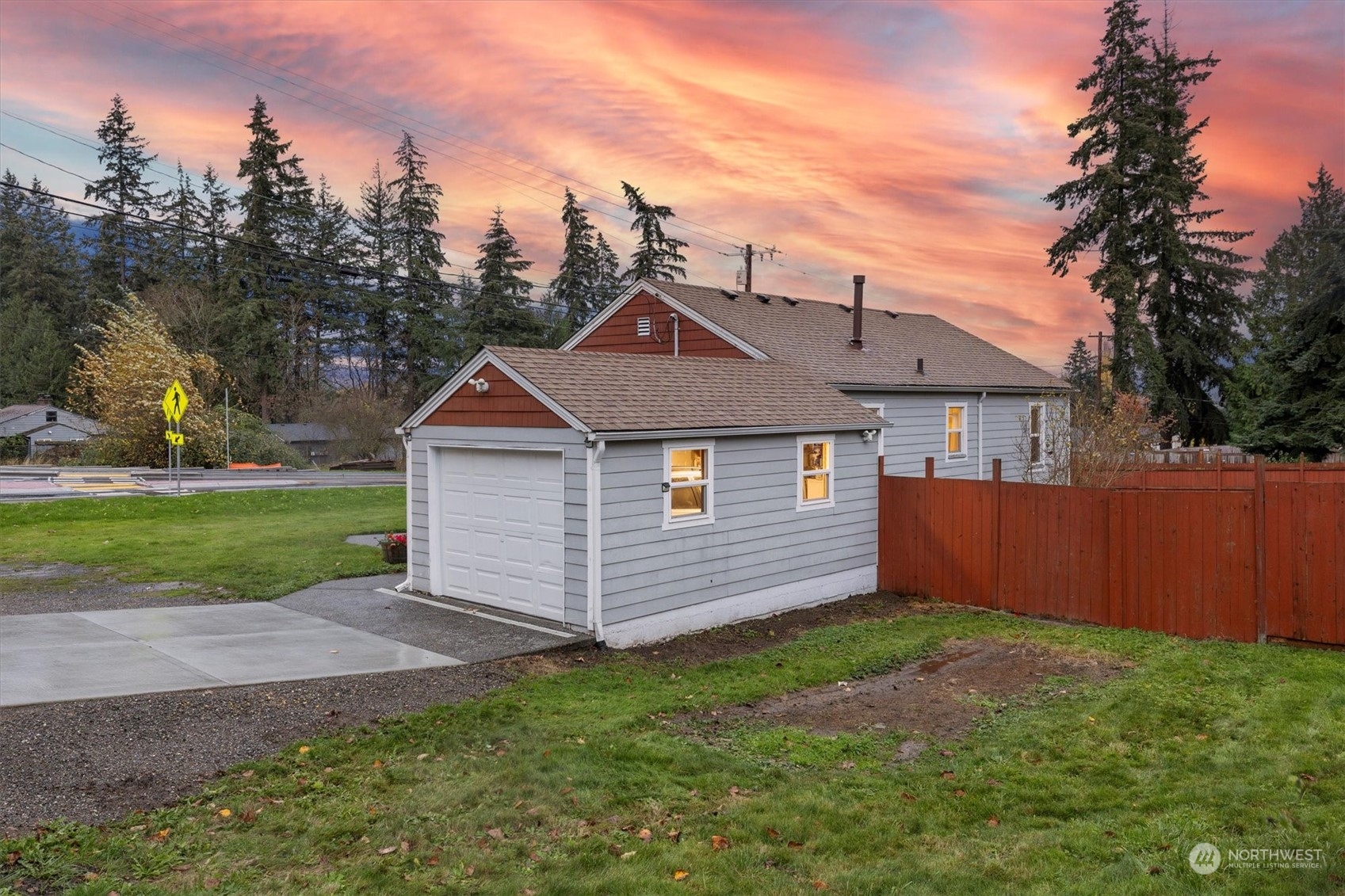 24008 Meridian Avenue South Bothell, WA 98021 - Photo 24 of 31 a front view of a house with a yard and garage