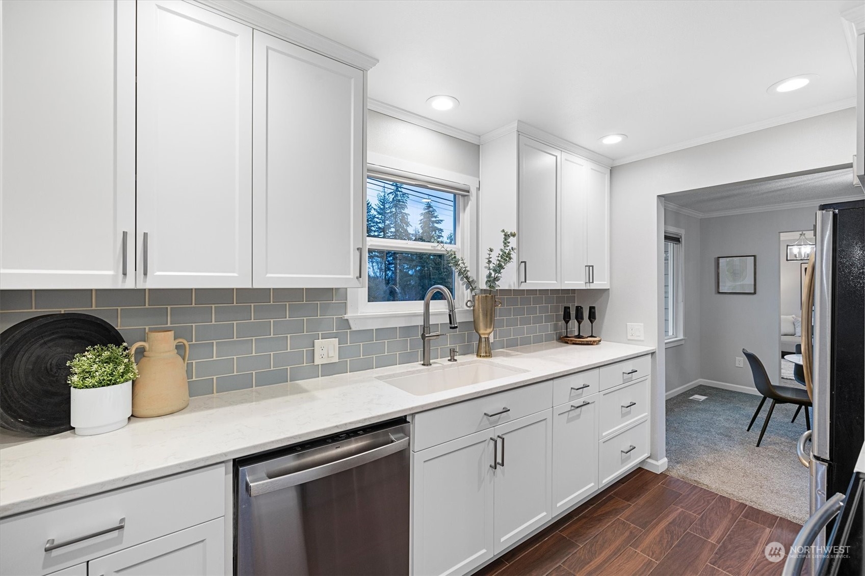 24008 Meridian Avenue South Bothell, WA 98021 - Photo 5 of 31 a kitchen with stainless steel appliances granite countertop a sink a stove and cabinets