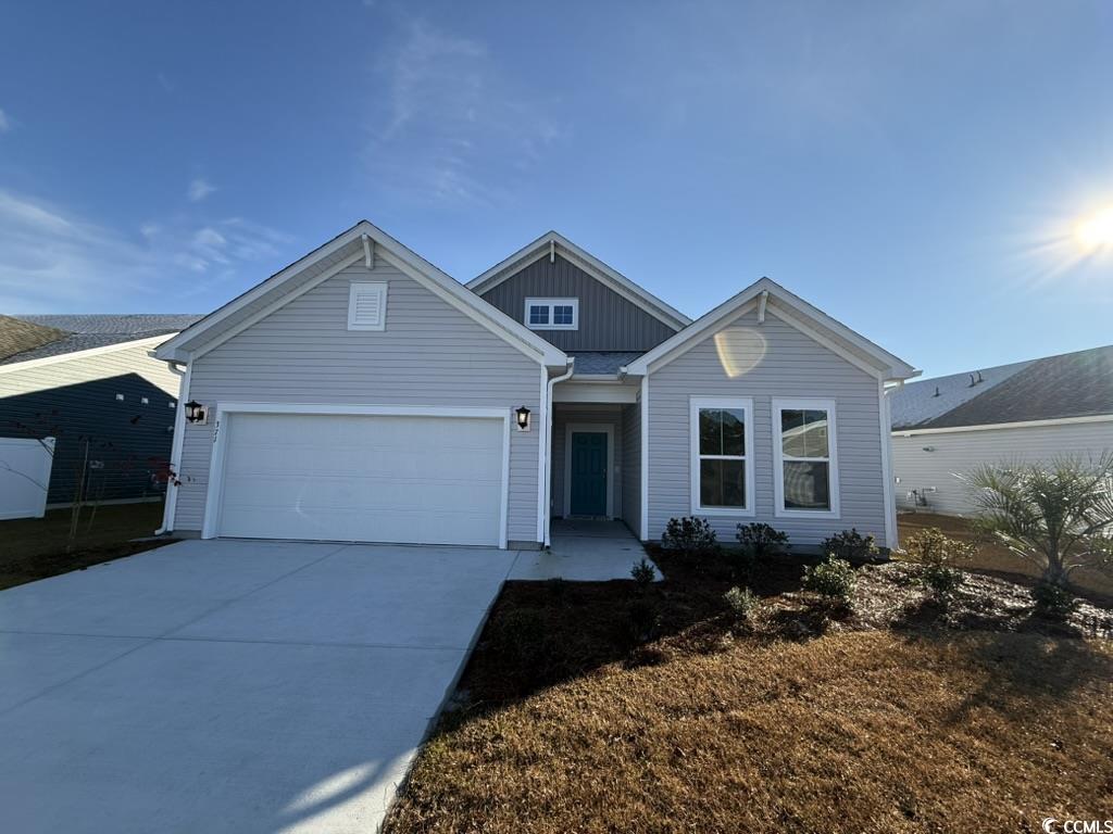 371 Kapalua Loop Little River, SC 29566 - Photo 1 of 37 View of front of property featuring driveway, a garage, and board and batten siding