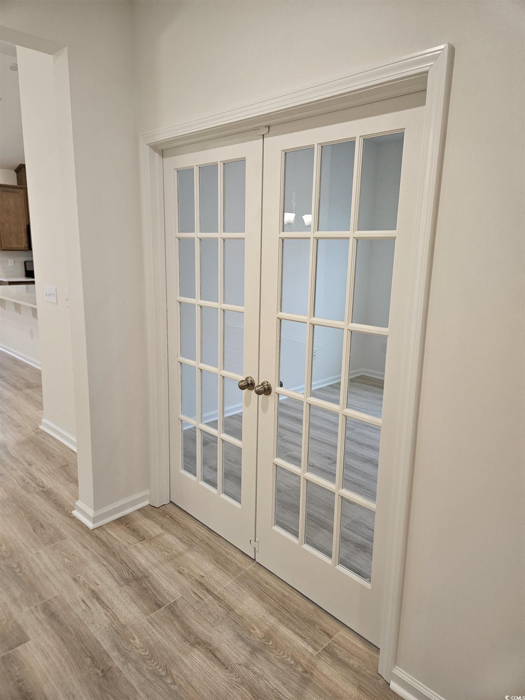 371 Kapalua Loop Little River, SC 29566 - Photo 13 of 37 Detailed view of french doors and wood finished floors
