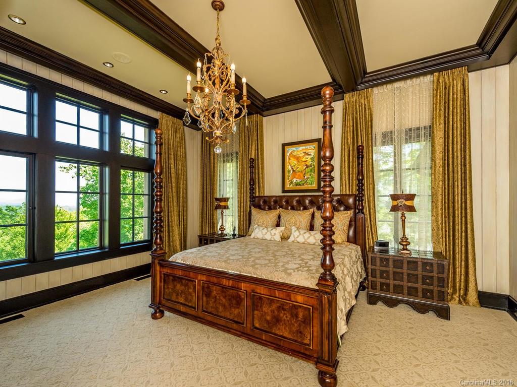 1929 Tree View Trail Arden, NC 28704 - Photo 13 of 35 a bed sitting in a spacious bedroom next to a window