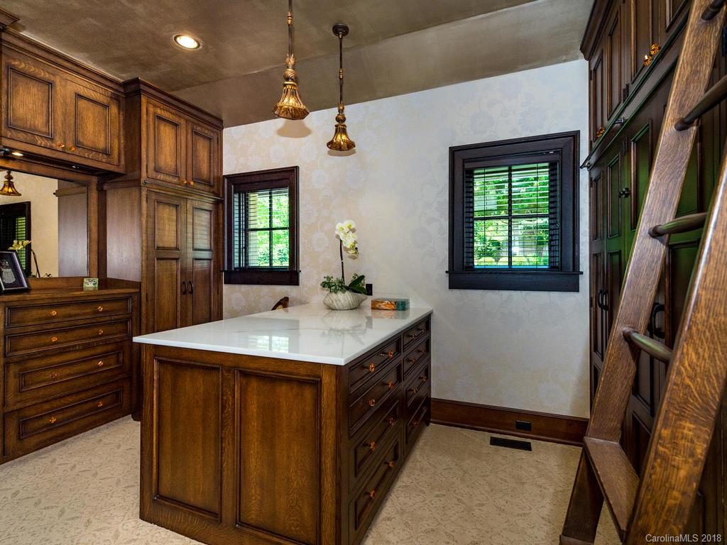 1929 Tree View Trail Arden, NC 28704 - Photo 15 of 35 a kitchen that has a sink a microwave oven a stove and a refrigerator