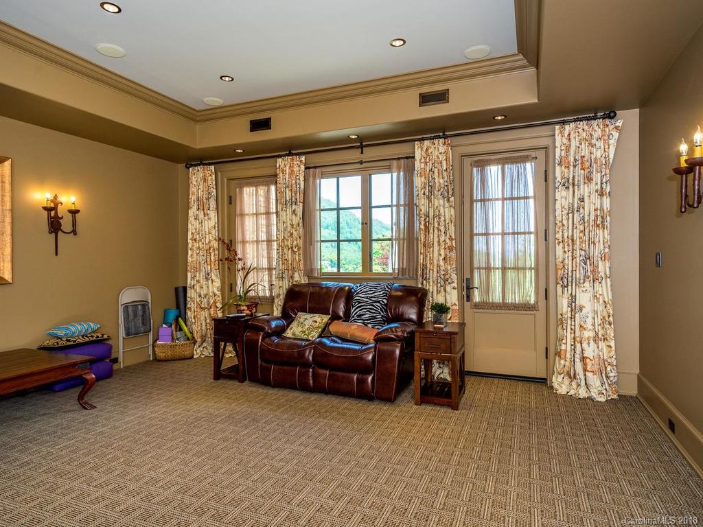 1929 Tree View Trail Arden, NC 28704 - Photo 18 of 35 a living room with furniture and large windows
