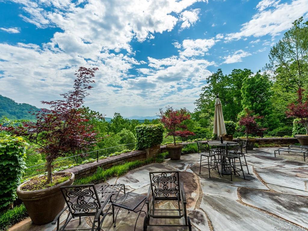 1929 Tree View Trail Arden, NC 28704 - Photo 27 of 35 a swimming pool with outdoor seating and plants