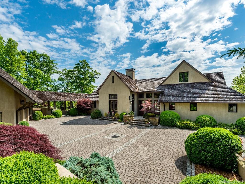 1929 Tree View Trail Arden, NC 28704 - Photo 30 of 35 a view of a house with a small yard plants and a large tree
