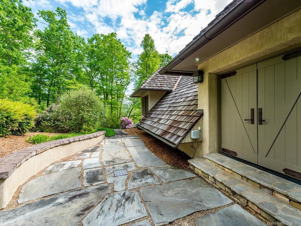 1929 Tree View Trail Arden, NC 28704 - Photo 32 of 35 a view of a wooden door with a yard