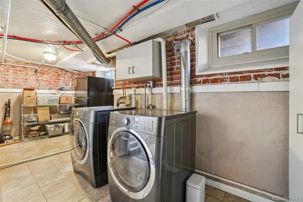 a view of washer and dryer in a utility room