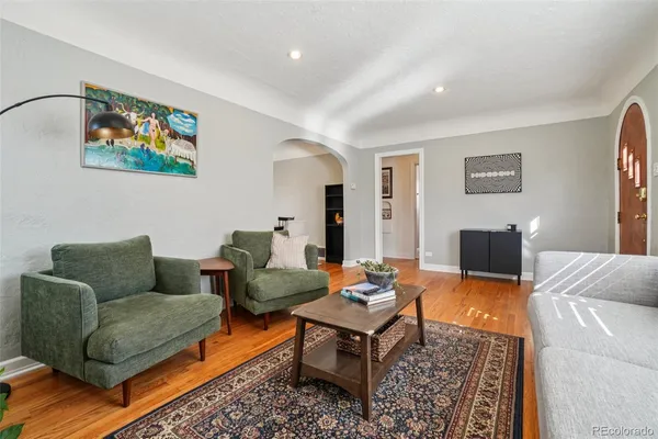 a view of a dining room with furniture and wooden floor