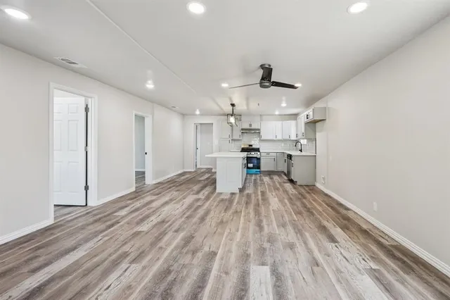a view of kitchen with cabinets and stainless steel appliances