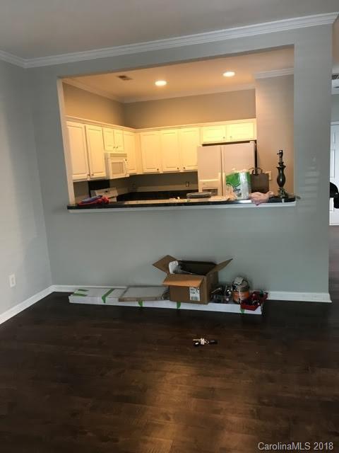 14925 Scothurst Lane Charlotte, NC 28277 - Photo 4 of 9 a kitchen with a sink a counter space and a window