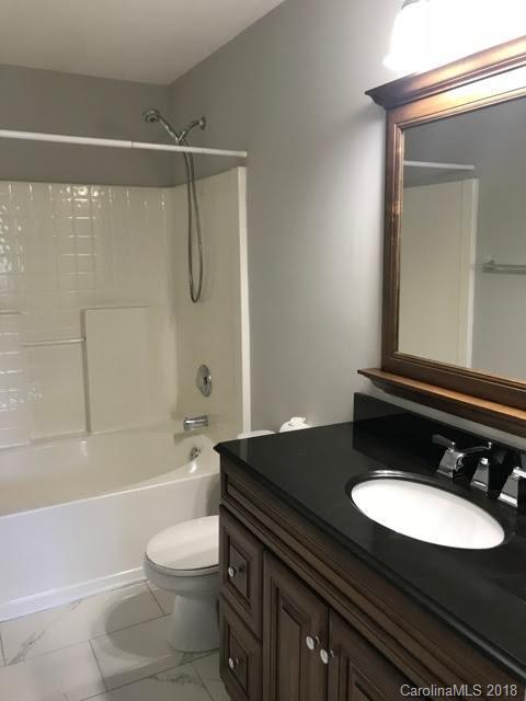 14925 Scothurst Lane Charlotte, NC 28277 - Photo 8 of 9 a bathroom with a sink a toilet and a bathtub
