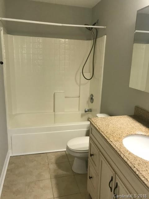 14925 Scothurst Lane Charlotte, NC 28277 - Photo 9 of 9 a bathroom with a granite countertop bathtub shower sink vanity and toilet
