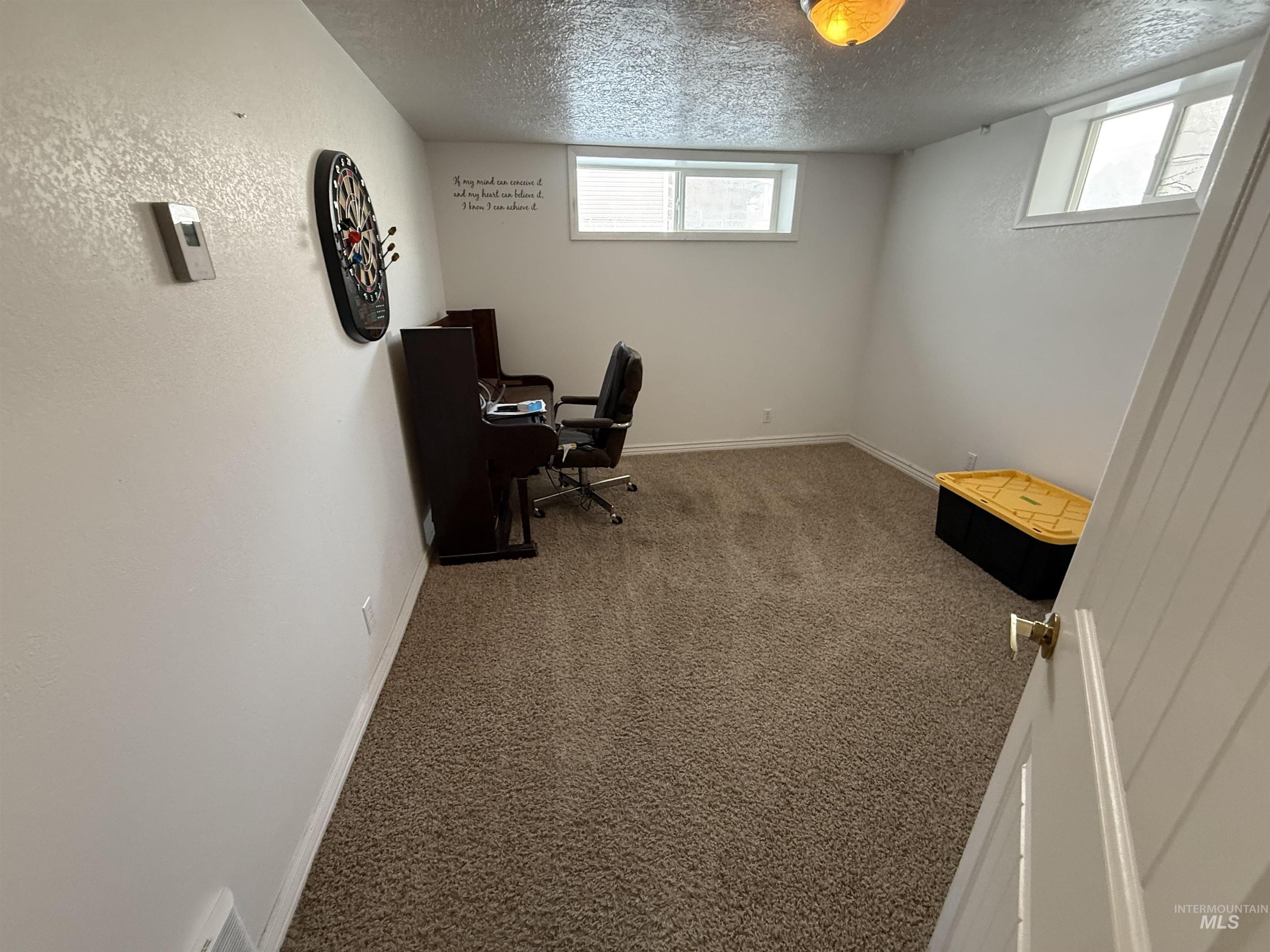4926 Easy Street Chubbuck, ID 83202 - Photo 12 of 29 Office with carpet floors and a textured ceiling
