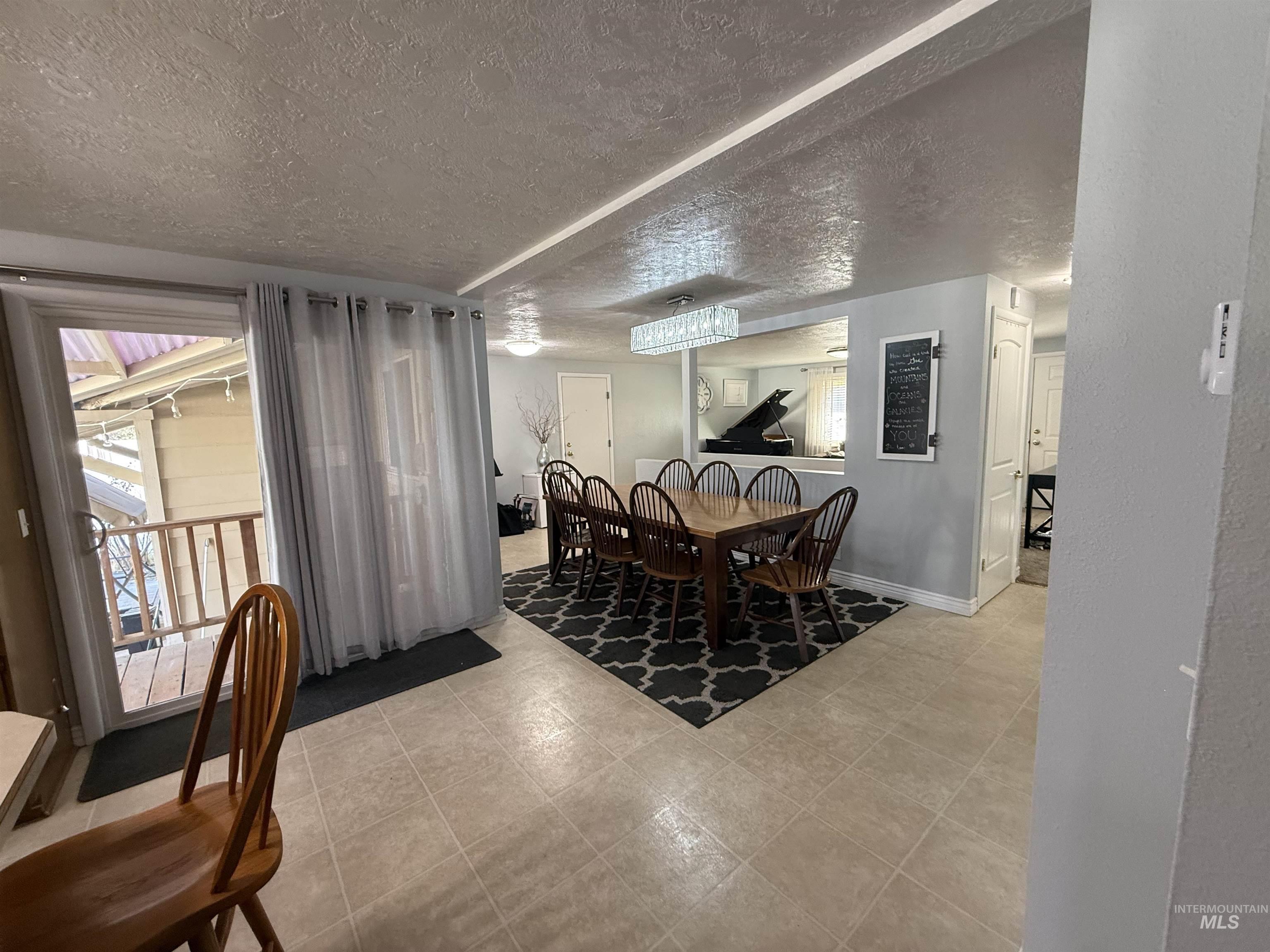 4926 Easy Street Chubbuck, ID 83202 - Photo 10 of 29 Dining area with a textured ceiling