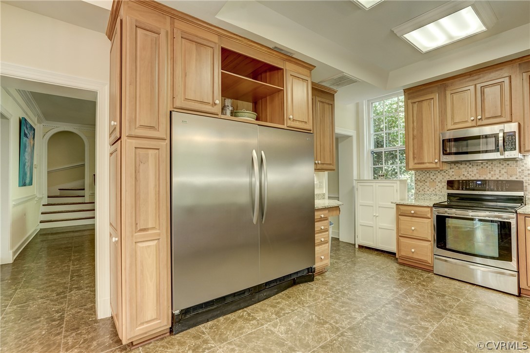 4701 Butte Road Richmond, VA 23235 - Photo 11 of 47 a kitchen with stainless steel appliances granite countertop a refrigerator and a stove