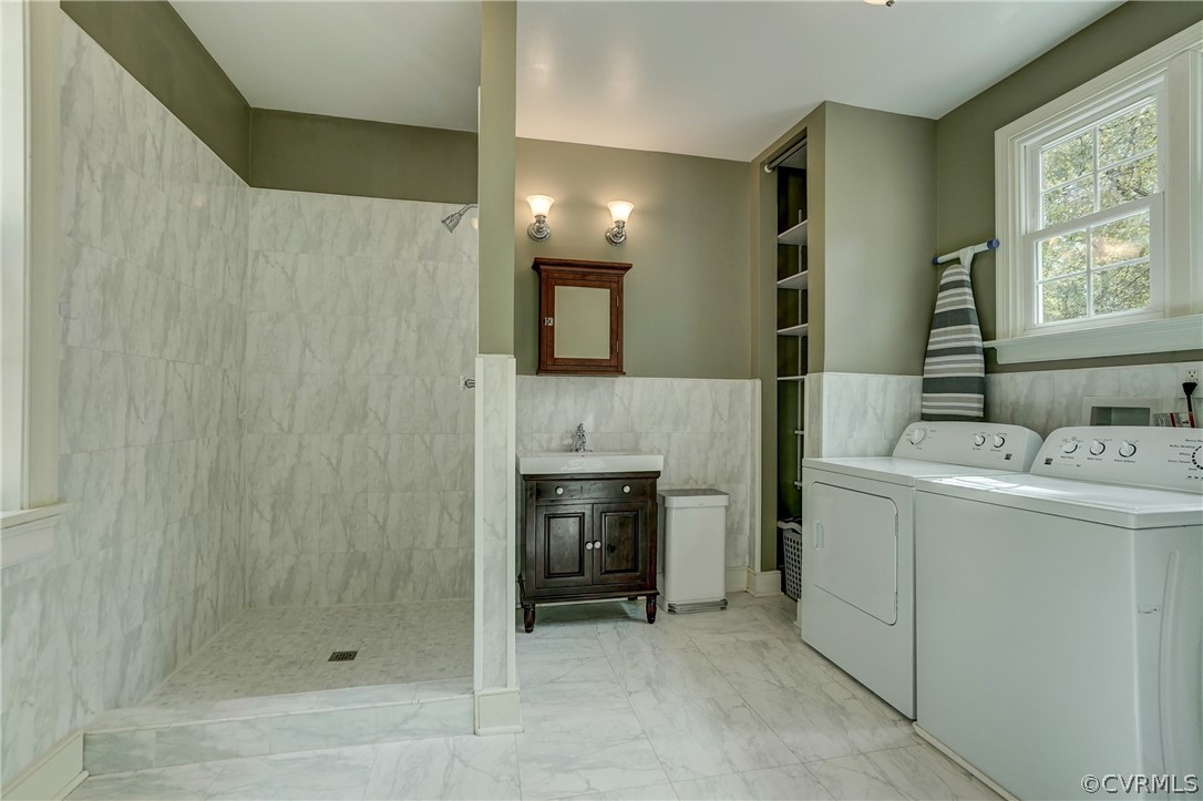 4701 Butte Road Richmond, VA 23235 - Photo 30 of 47 a bathroom with a sink a toilet and shower