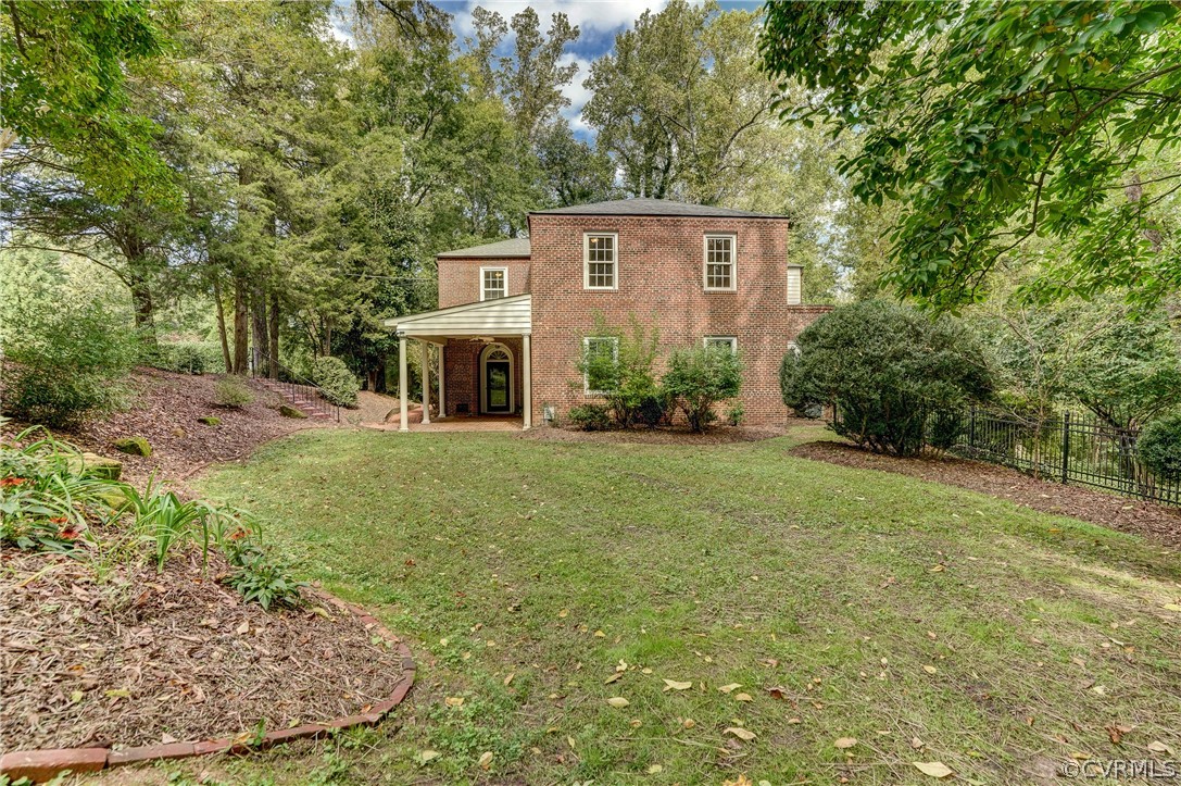 4701 Butte Road Richmond, VA 23235 - Photo 3 of 47 a front view of a house with a yard