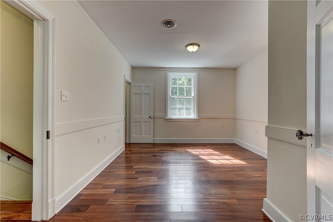 4701 Butte Road Richmond, VA 23235 - Photo 31 of 47 a view of a hallway with wooden floor and a window