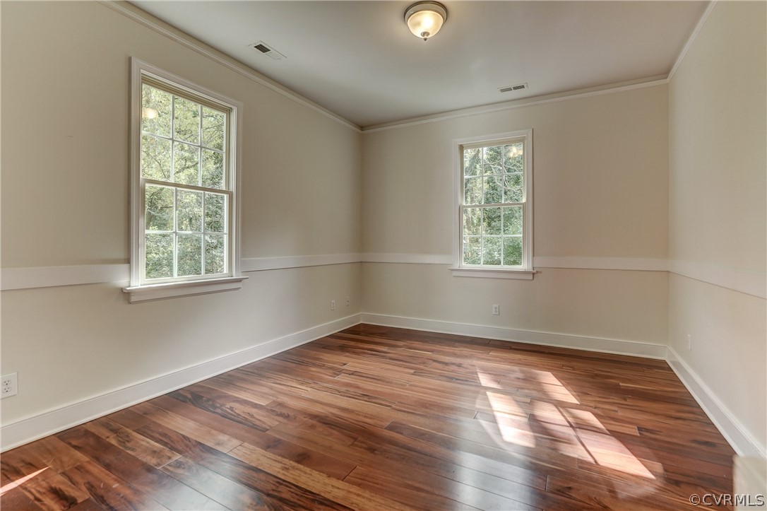 4701 Butte Road Richmond, VA 23235 - Photo 34 of 47 an empty room with wooden floor and windows