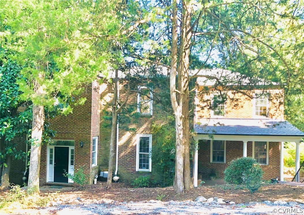 4701 Butte Road Richmond, VA 23235 - Photo 4 of 47 a front view of a house with a tree