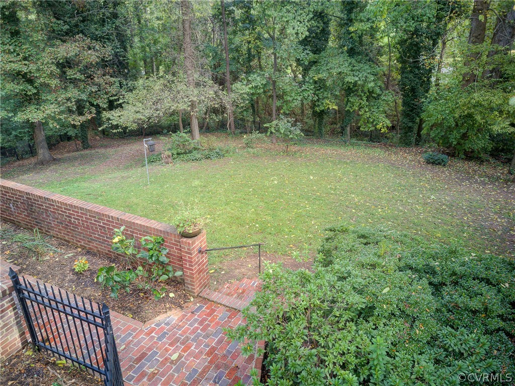 4701 Butte Road Richmond, VA 23235 - Photo 43 of 47 a view of a yard with plants and large trees