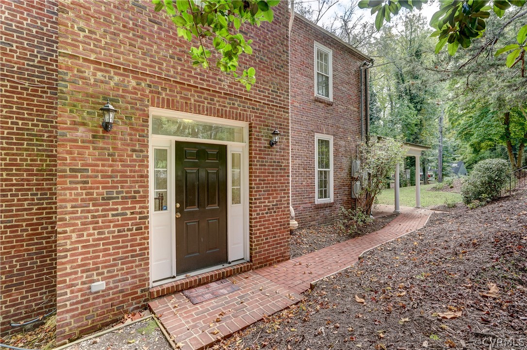 4701 Butte Road Richmond, VA 23235 - Photo 46 of 47 a front view of a house with a garden
