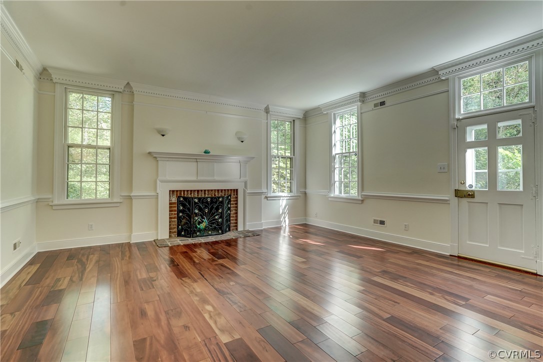4701 Butte Road Richmond, VA 23235 - Photo 6 of 47 an empty room with wooden floor and windows