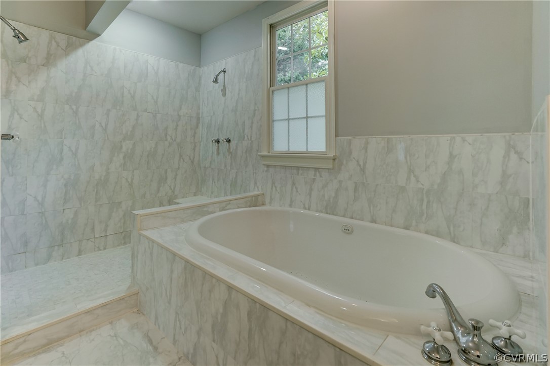 4701 Butte Road Richmond, VA 23235 - Photo 7 of 47 a bath tub sitting next to a window