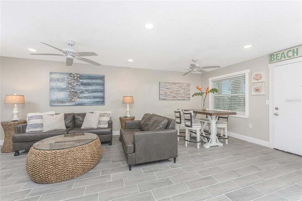 5041 North Beach Road, Unit 3A AND 3B Englewood, FL 34223 - Photo 11 of 52 a living room with furniture and a large window