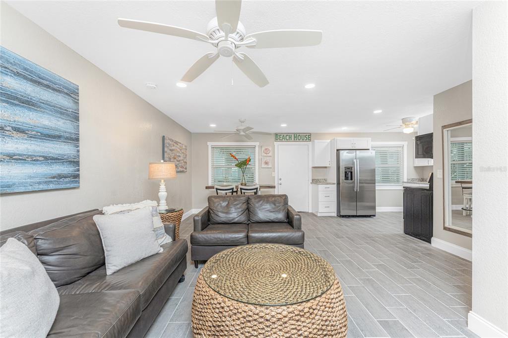 5041 North Beach Road, Unit 3A AND 3B Englewood, FL 34223 - Photo 13 of 52 a living room with furniture and kitchen view