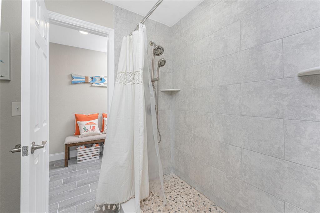 5041 North Beach Road, Unit 3A AND 3B Englewood, FL 34223 - Photo 20 of 52 a bathroom with a shower