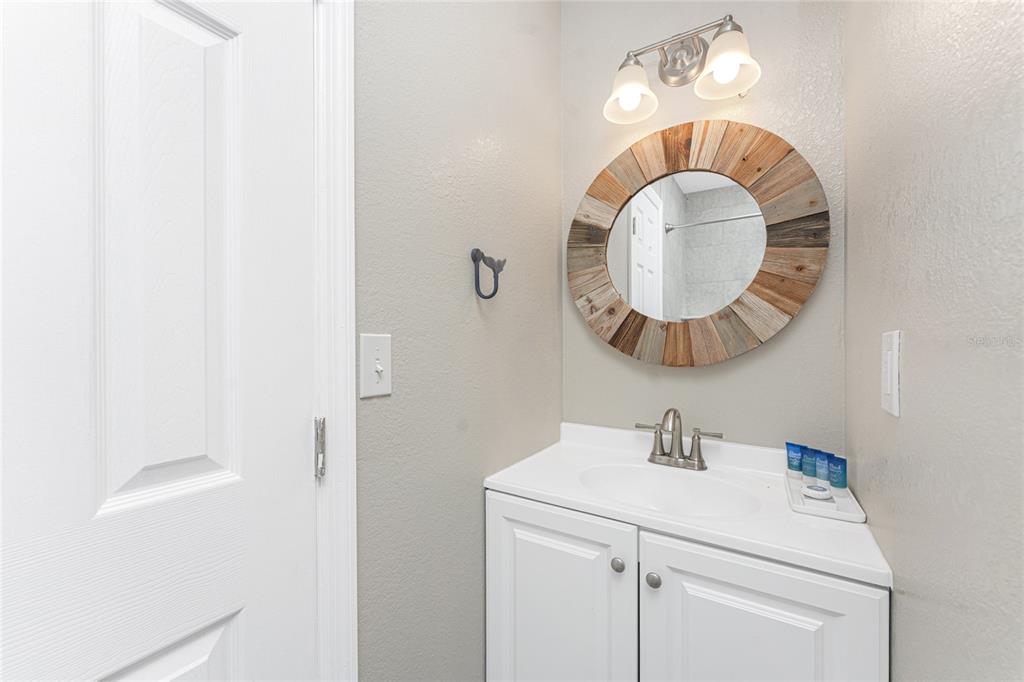 5041 North Beach Road, Unit 3A AND 3B Englewood, FL 34223 - Photo 21 of 52 a bathroom with a sink and a mirror