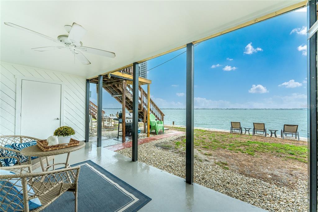 5041 North Beach Road, Unit 3A AND 3B Englewood, FL 34223 - Photo 25 of 52 a view of a livingroom with furniture and staircase