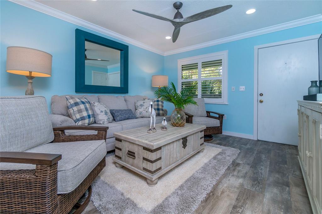 5041 North Beach Road, Unit 3A AND 3B Englewood, FL 34223 - Photo 31 of 52 a living room with furniture and a large window